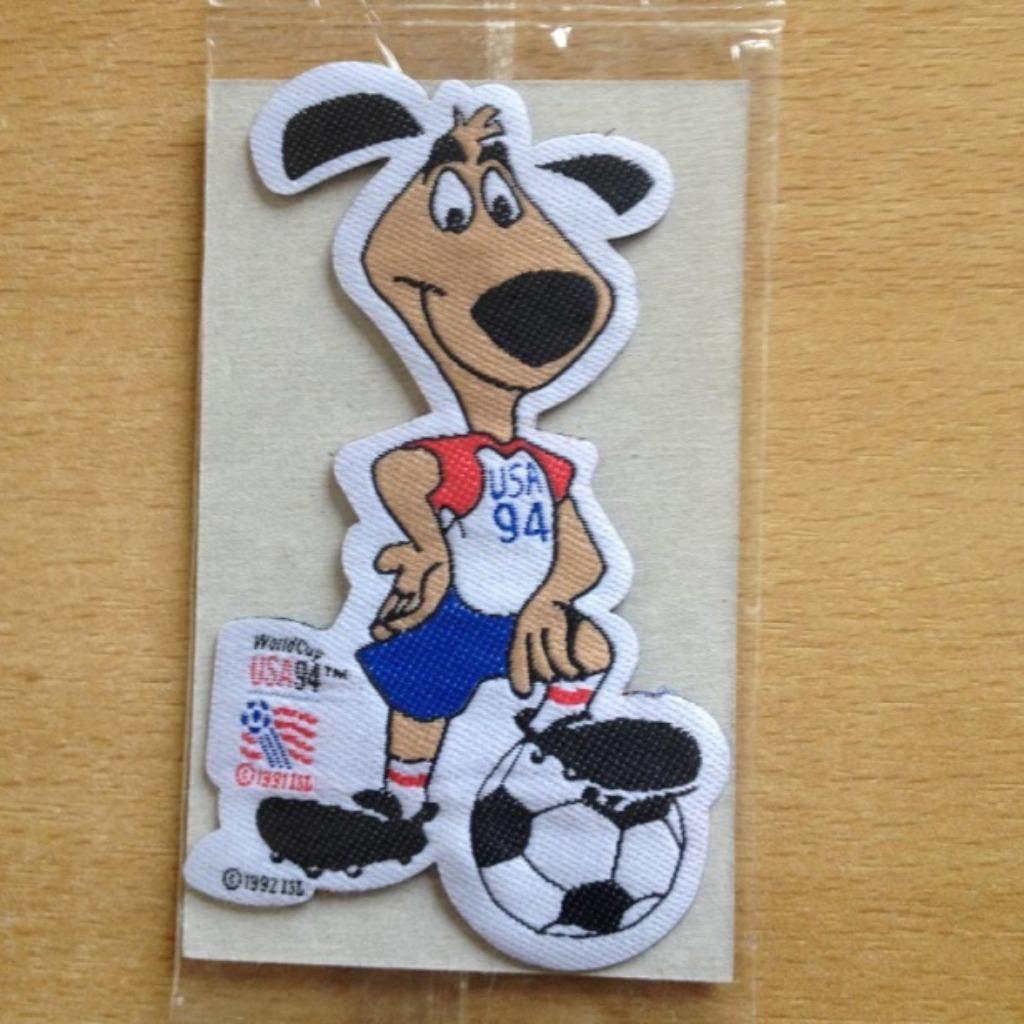 opstrijk figuur voetbal World Cup USA 94 - hond met voetbal, Verzamelen, Ophalen of Verzenden, Nieuw, Shirt