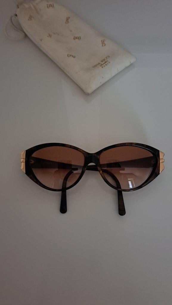 Nina Ricci zonnebril, Handtassen en Accessoires, Ophalen of Verzenden, Zo goed als nieuw, Bruin, Zonnebril