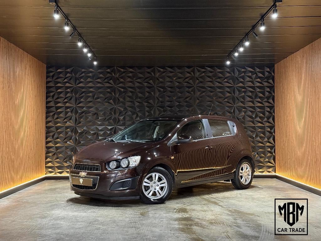 ✅ Chevrolet Aveo 1.2i 12 Maand GARANTIE Airco Cruise Control, Auto's, Chevrolet, Voorwielaandrijving, Euro 5, Stof, 4 cilinders