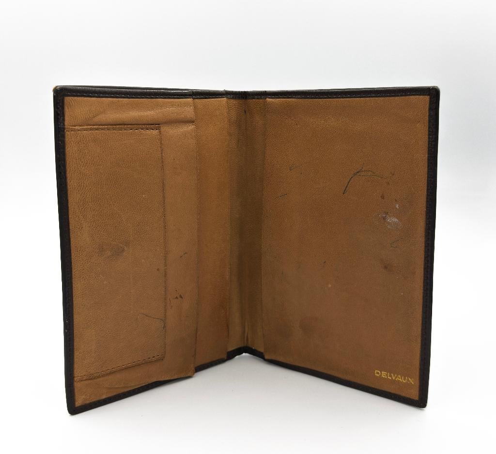 Een vintage lederen Delvaux portefeuille in het zwart bruin, Autres marques, Cuir, Enlèvement ou Envoi, Utilisé