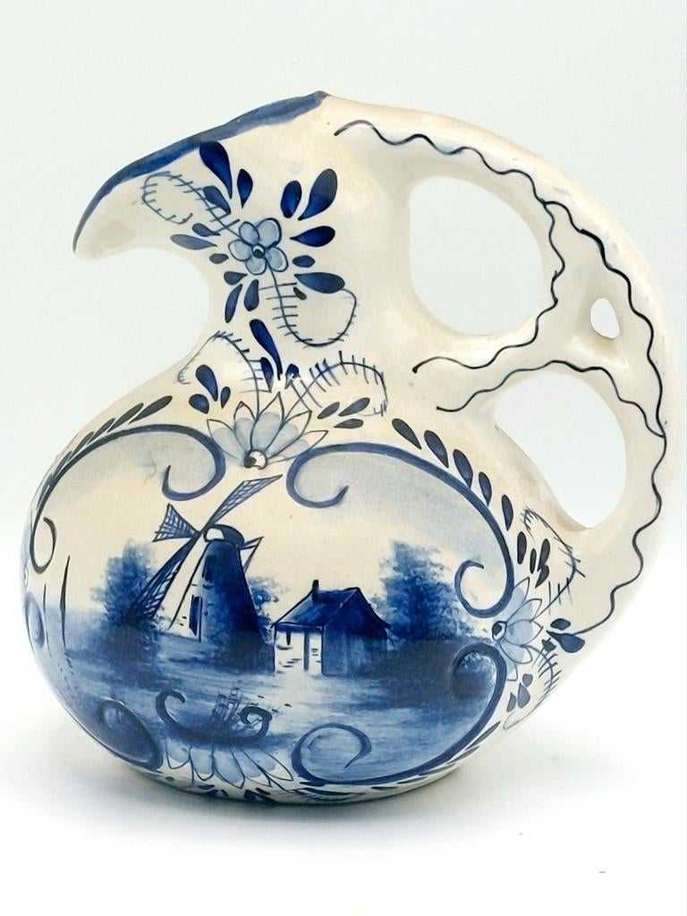Cruche bleue de Delft avec moulin à vent, Enlèvement