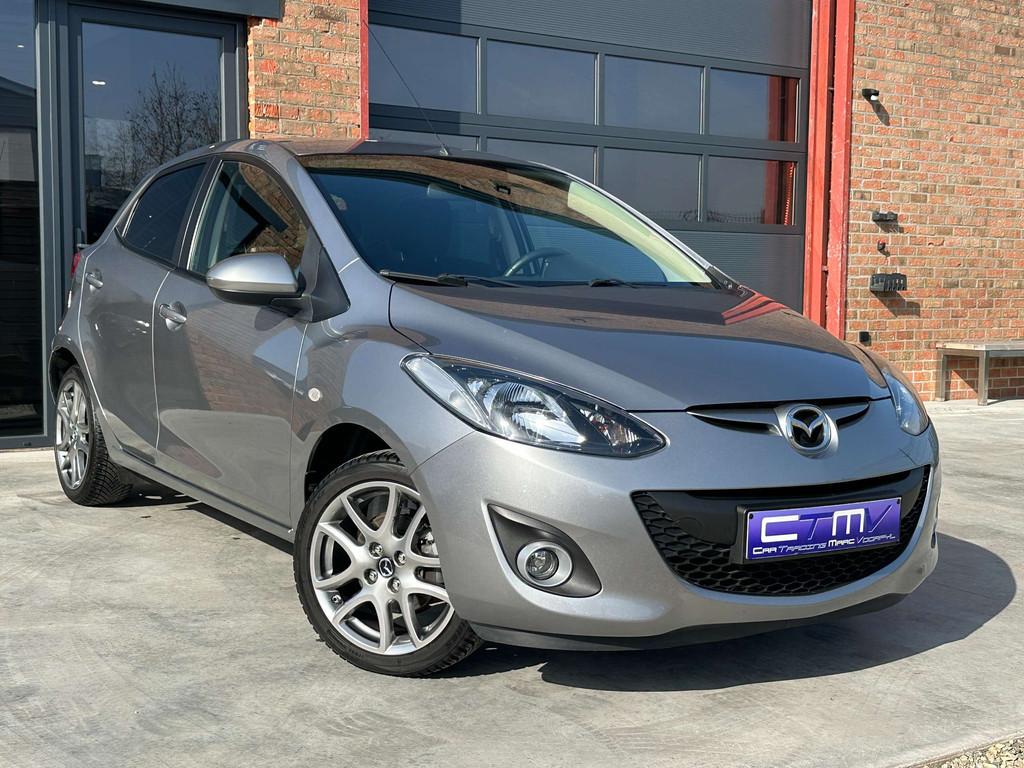 Mazda 2 1.3i 5dr Airco - Navi - Trekhaak - 1ste Eigenaar!, Auto's, Mazda, Euro 5, Stof, Gebruikt, Zwart