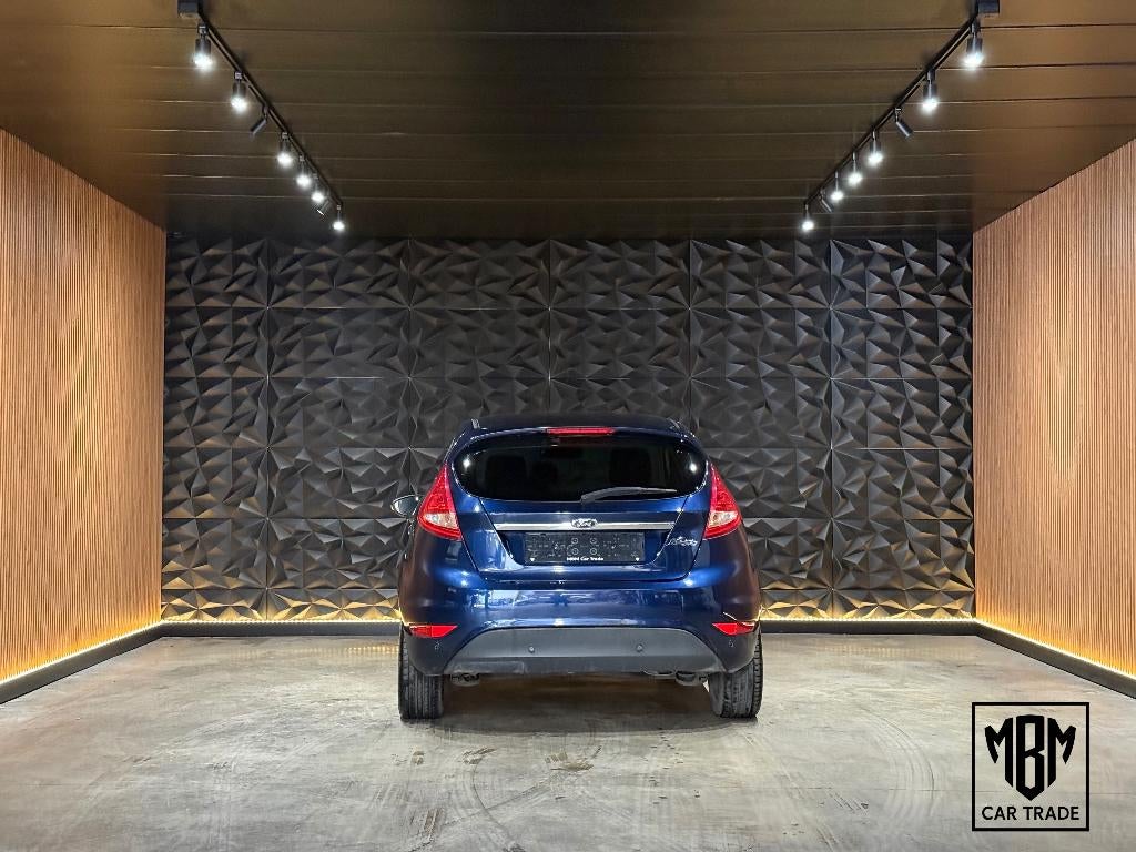 ✅Ford Fiesta 1.2i Titanium GARANTIE Airco Parksensoren 1.Eig, Voorwielaandrijving, Euro 5, Stof, 4 cilinders
