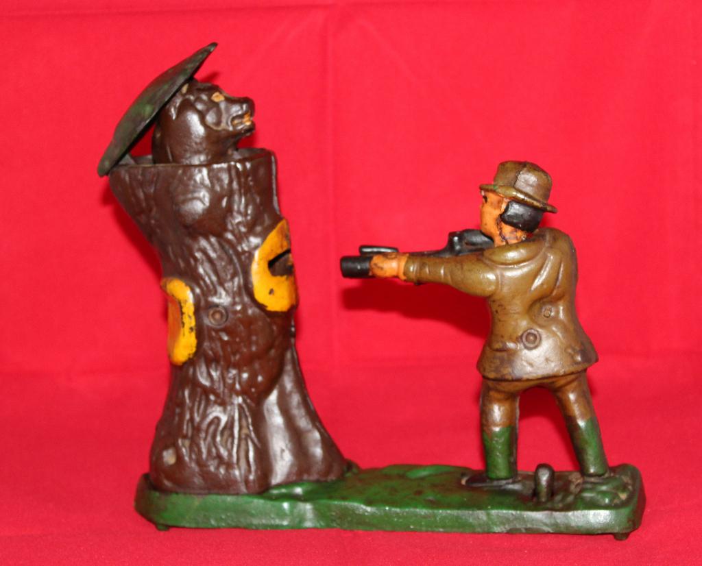 Mechanische gietijzeren spaarpot met jager., Antiek en Kunst, Antiek | Speelgoed, Ophalen of Verzenden