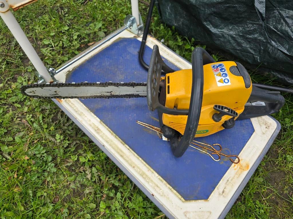 Boomzaag op benzine, Ophalen