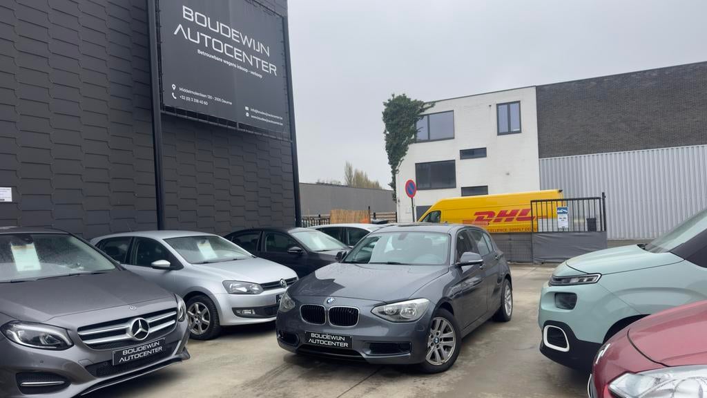 Bmw 1 Serie 116i Automaat 1.6Benzine Topstaat 142.xxxkm, Zwart, 5 deurs, https://public.car-pass.be/vhr/a2b14aae-e446-422d-b46d-812df094fc6f