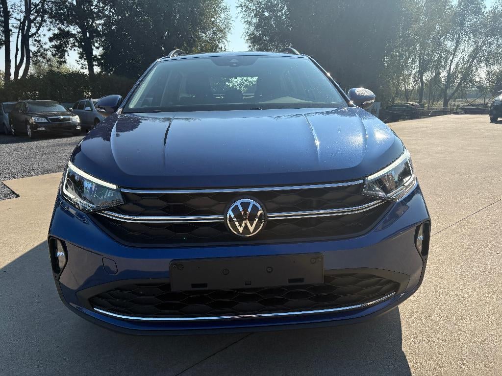 Vw Taigo 1.0 TSI Life Parkeersensoren + App Connect, Auto's, Voorwielaandrijving, Stof, 1200 kg, Blauw