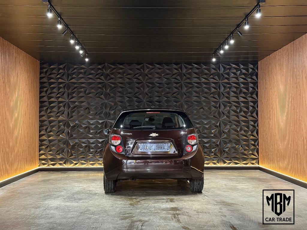 ✅ Chevrolet Aveo 1.2i 12 Maand GARANTIE Airco Cruise Control, Auto's, Chevrolet, Voorwielaandrijving, Euro 5, Stof, 4 cilinders