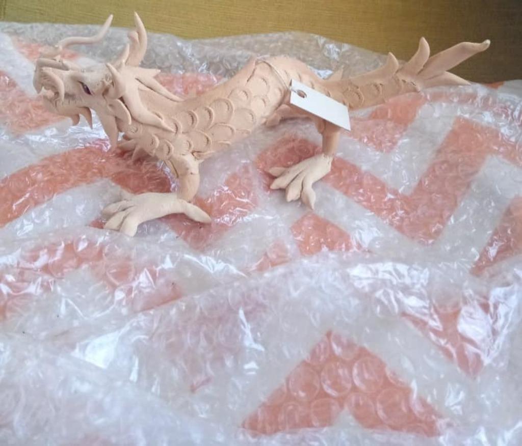 draak in hout, Enlèvement ou Envoi