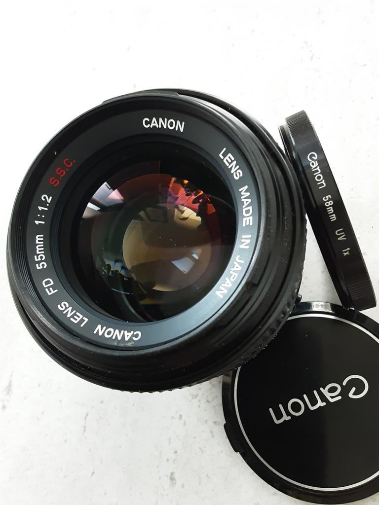 Objectif Canon FD 55mm 1:1.2 S.S.C, filtre UV Canon, comme n, TV, Hi-fi & Vidéo, Enlèvement ou Envoi, Comme neuf, Lentille standard