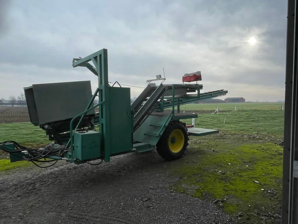 Bloemkooloogstmachine baekeland, Ophalen