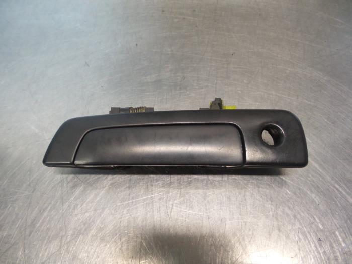 Poignée portière 2portes gauche d'un Mitsubishi Colt (Colt, -, Utilisé, Mitsubishi, -