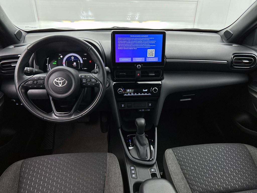 Toyota Yaris Cross 1.5 VVT-ie Hybrid 85kW Dynamic Plus CVT |, Stof, Gebruikt, 750 kg, https://public.car-pass.be/vhr/38ad25f9-5481-4f65-aa64-9a0cb2e7944e