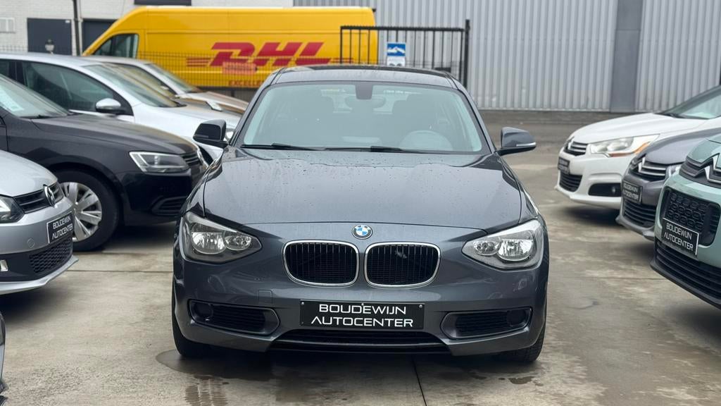 Bmw 1 Serie 116i Automaat 1.6Benzine Topstaat 142.xxxkm, Zwart, 5 deurs, https://public.car-pass.be/vhr/a2b14aae-e446-422d-b46d-812df094fc6f